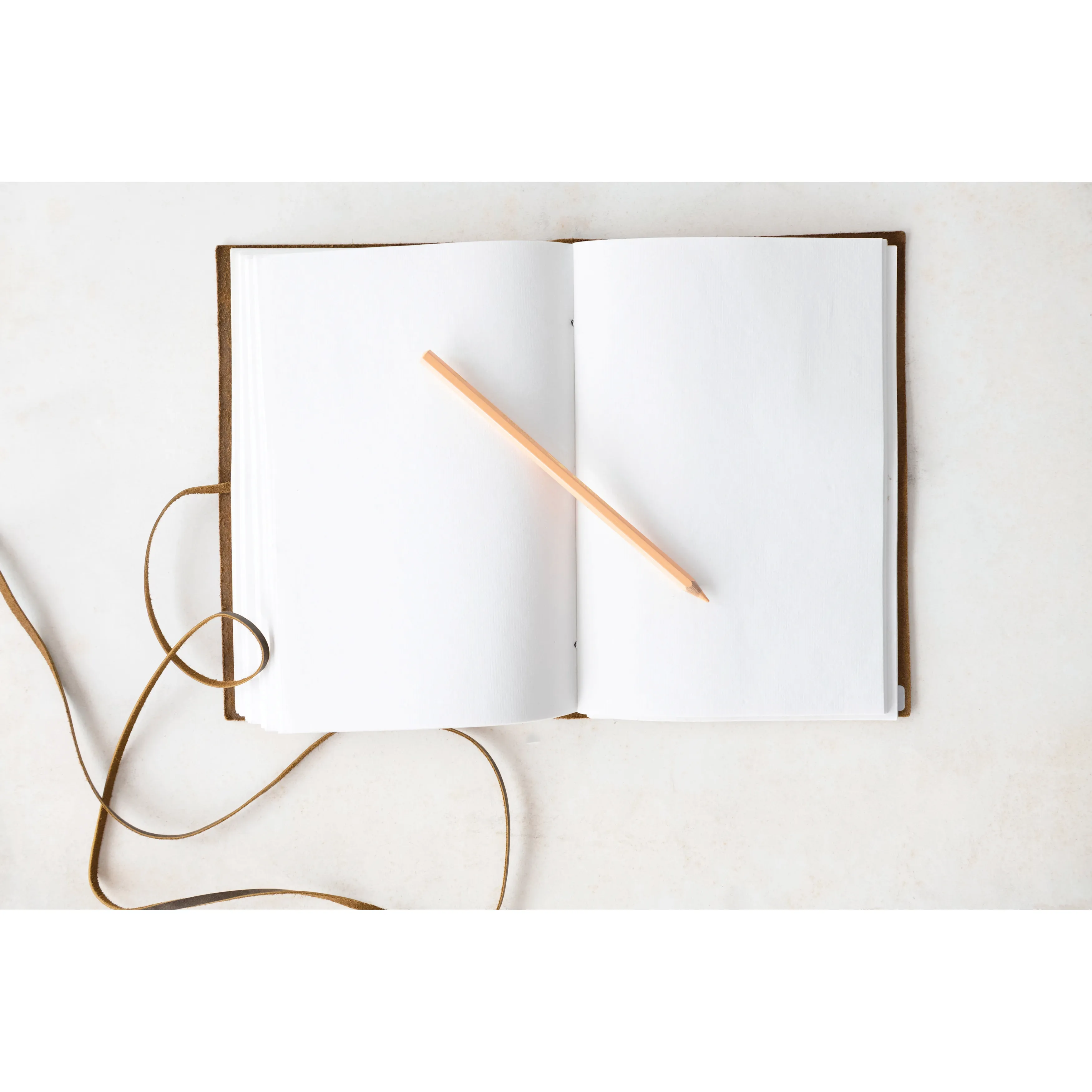 Brown leather journal with handmade paper